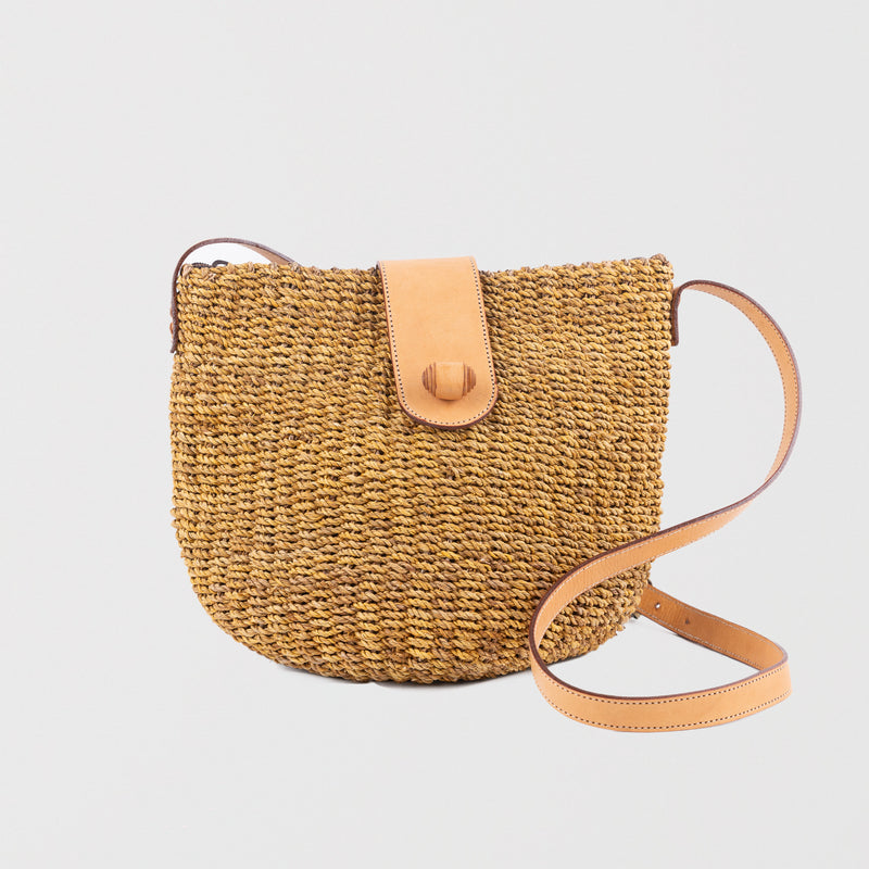 Brown large seagrass handbag with adjustable leather shoulder straps. Zip & leather fastener closings. Fully lined with inside pocket. Available in brown and cream