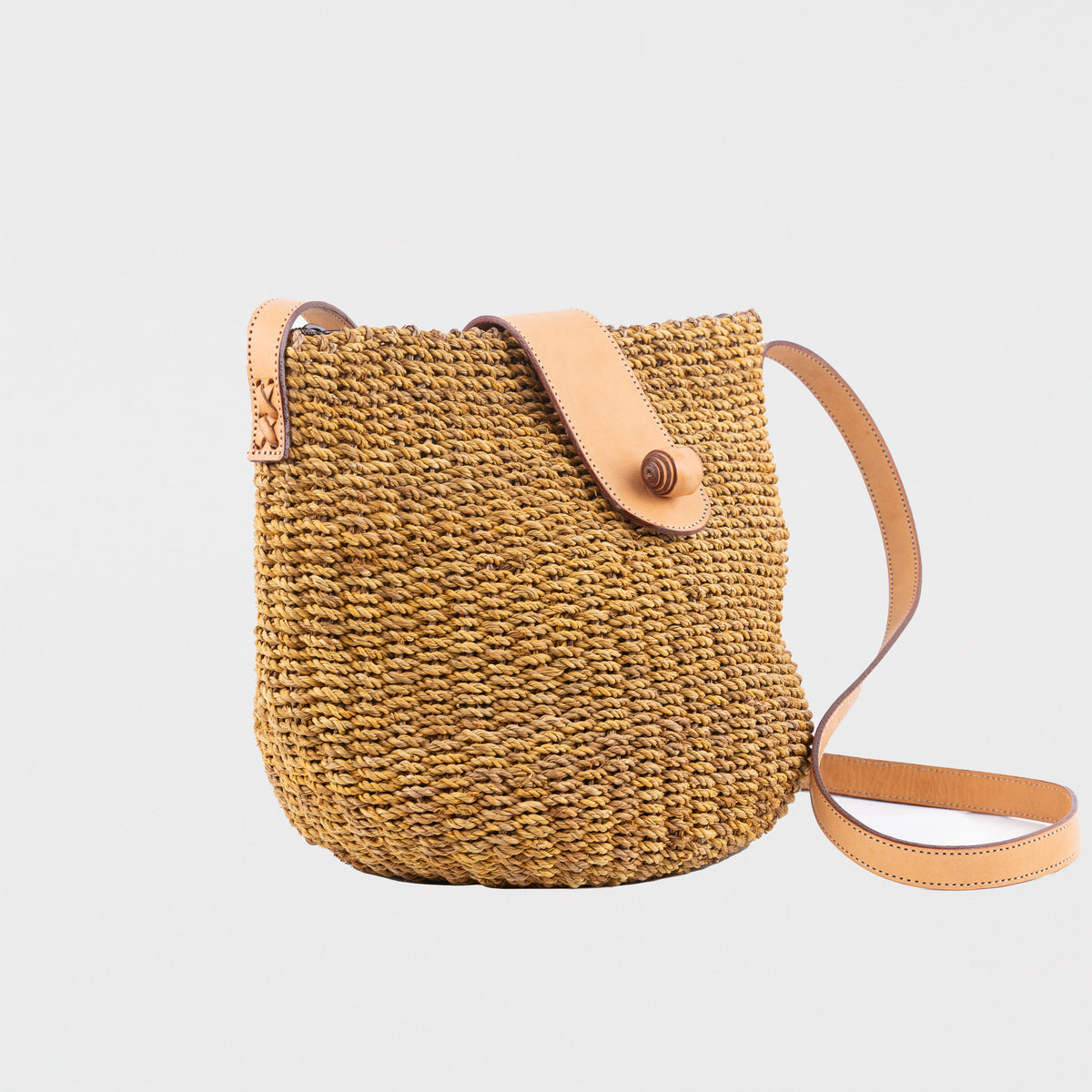 Brown large seagrass handbag with adjustable leather shoulder straps. Zip & leather fastener closings. Fully lined with inside pocket. Available in brown and cream