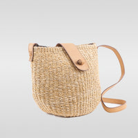 Large light natural seagrass handbag with adjustable leather shoulder straps. Zip & leather fastener closings. Fully lined with inside pocket.