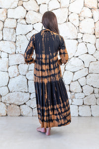 Womens button up long length tie dye dress in black and copper featuring a tiered silhouette, 3/4 length sleeves and pockets 
