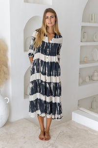 Womens button up mid length tie dye dress in black and cream featuring a tiered silhouette, 3/4 length sleeves and pockets 
