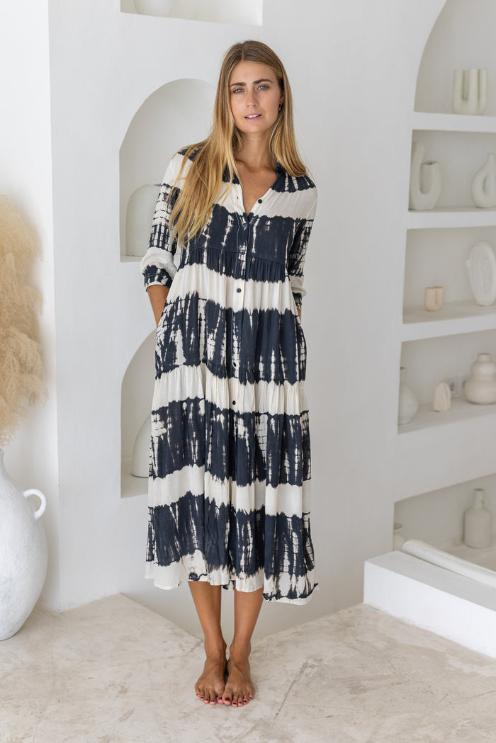 Womens button up mid length tie dye dress in black and cream featuring a tiered silhouette, 3/4 length sleeves and pockets 