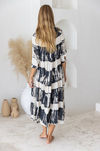 Womens button up mid length tie dye dress in black and cream featuring a tiered silhouette, 3/4 length sleeves and pockets 