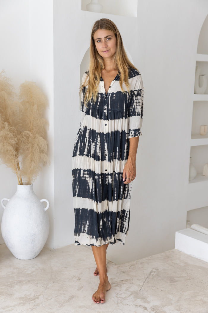 Womens button up mid length tie dye dress in black and cream featuring a tiered silhouette, 3/4 length sleeves and pockets 