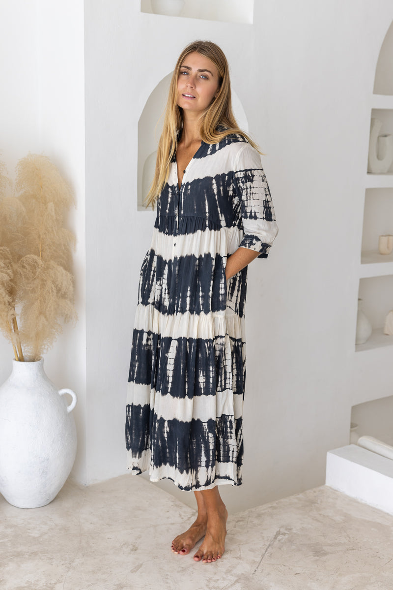 Womens button up mid length tie dye dress in black and cream featuring a tiered silhouette, 3/4 length sleeves and pockets 