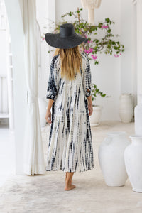 Womens button up mid length tie dye dress in cream featuring a tiered silhouette, 3/4 length sleeves and pockets 