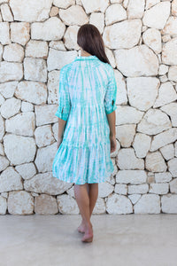 Womens button up short length tie dye dress in aqua blue featuring a tiered silhouette, 3/4 length sleeves and pockets 