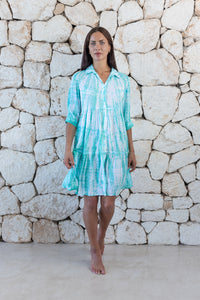 Womens button up short length tie dye dress in aqua blue featuring a tiered silhouette, 3/4 length sleeves and pockets 