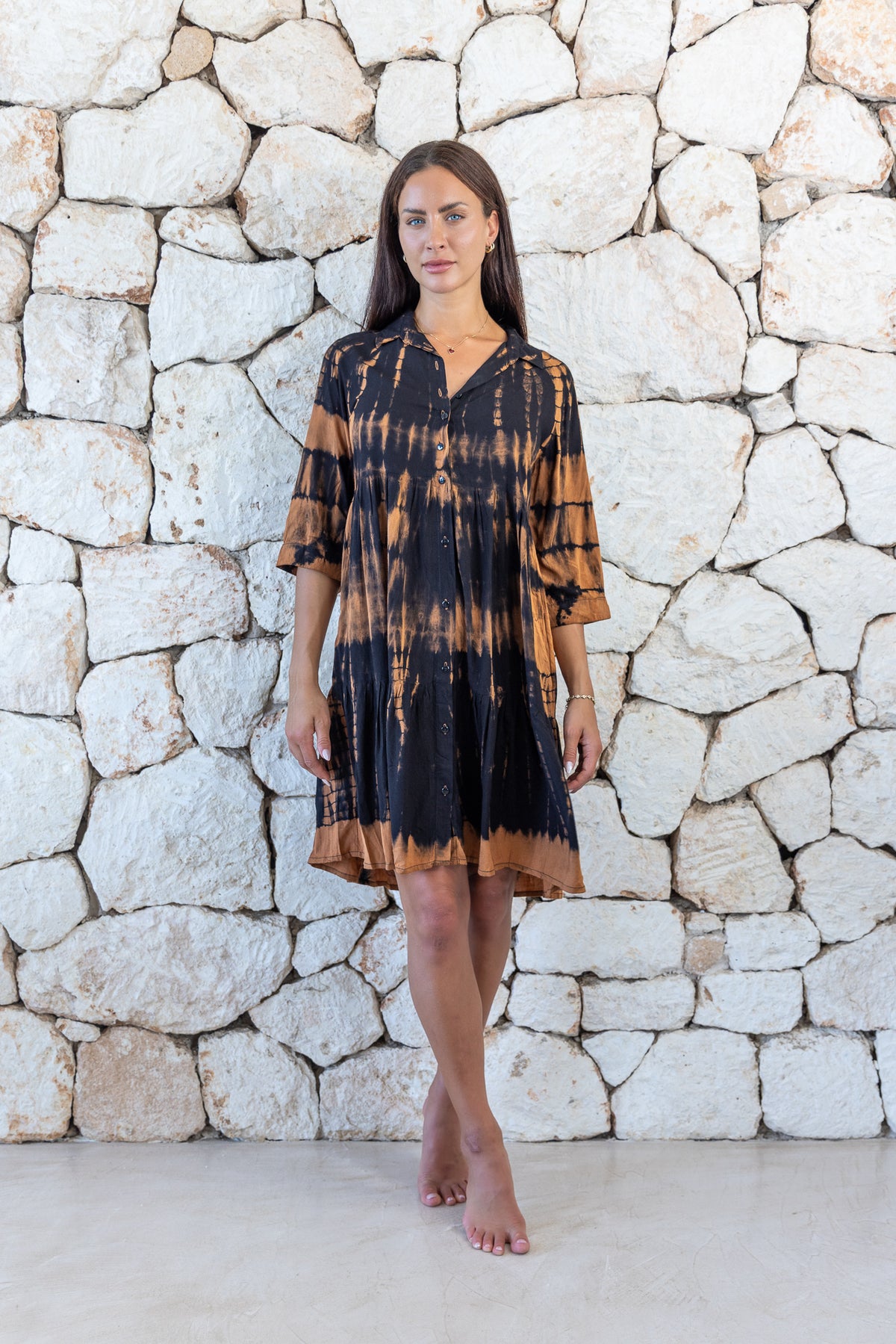 Womens button up short length tie dye dress in black and copper featuring a tiered silhouette, 3/4 length sleeves and pockets 