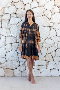 Womens button up short length tie dye dress in black and copper featuring a tiered silhouette, 3/4 length sleeves and pockets 