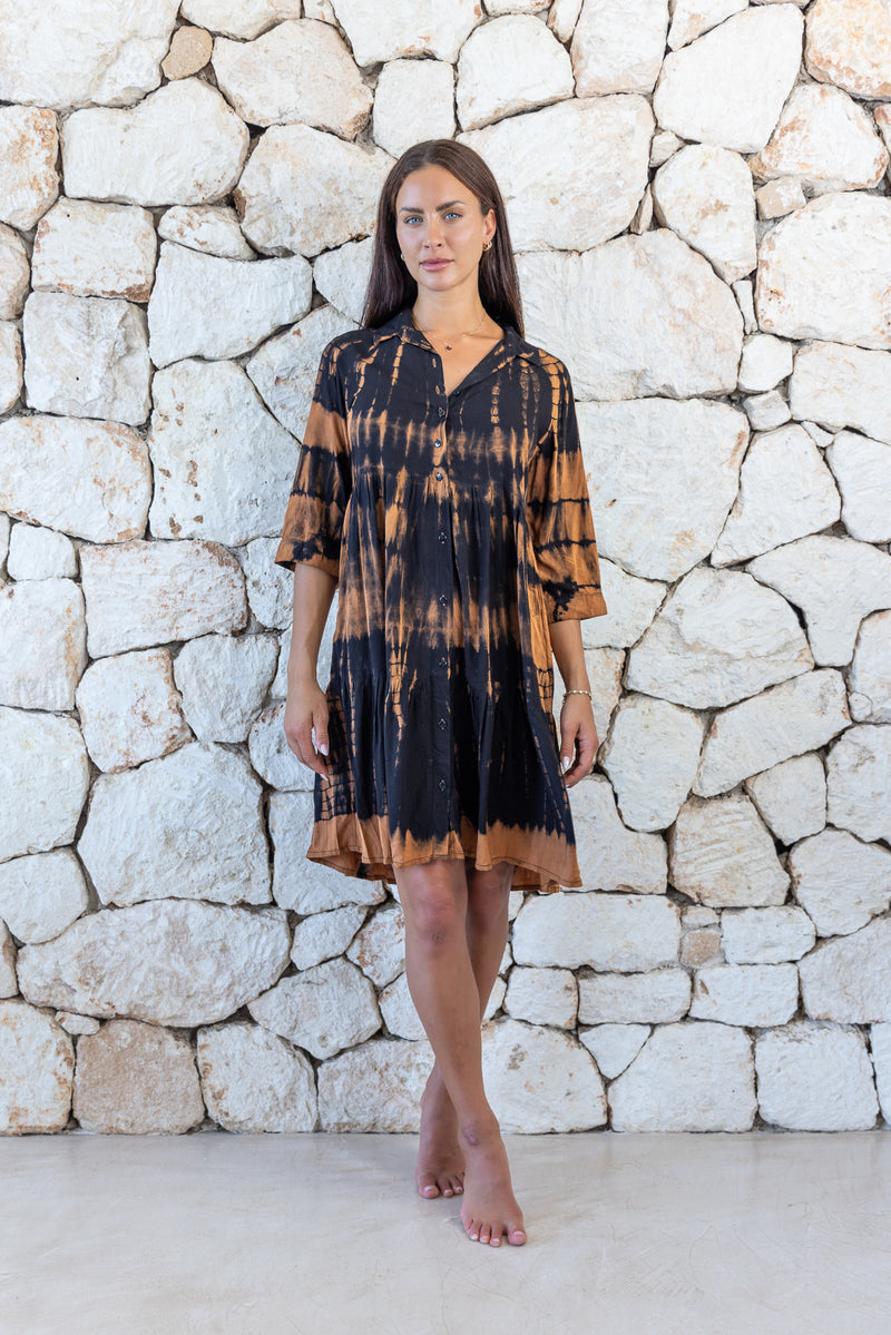 Womens button up short length tie dye dress in black and copper featuring a tiered silhouette, 3/4 length sleeves and pockets 