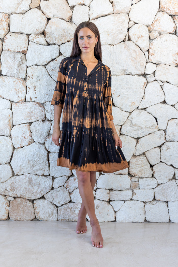 Womens button up short length tie dye dress in black and copper featuring a tiered silhouette, 3/4 length sleeves and pockets 