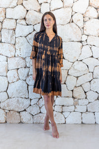 Womens button up short length tie dye dress in black and copper featuring a tiered silhouette, 3/4 length sleeves and pockets 