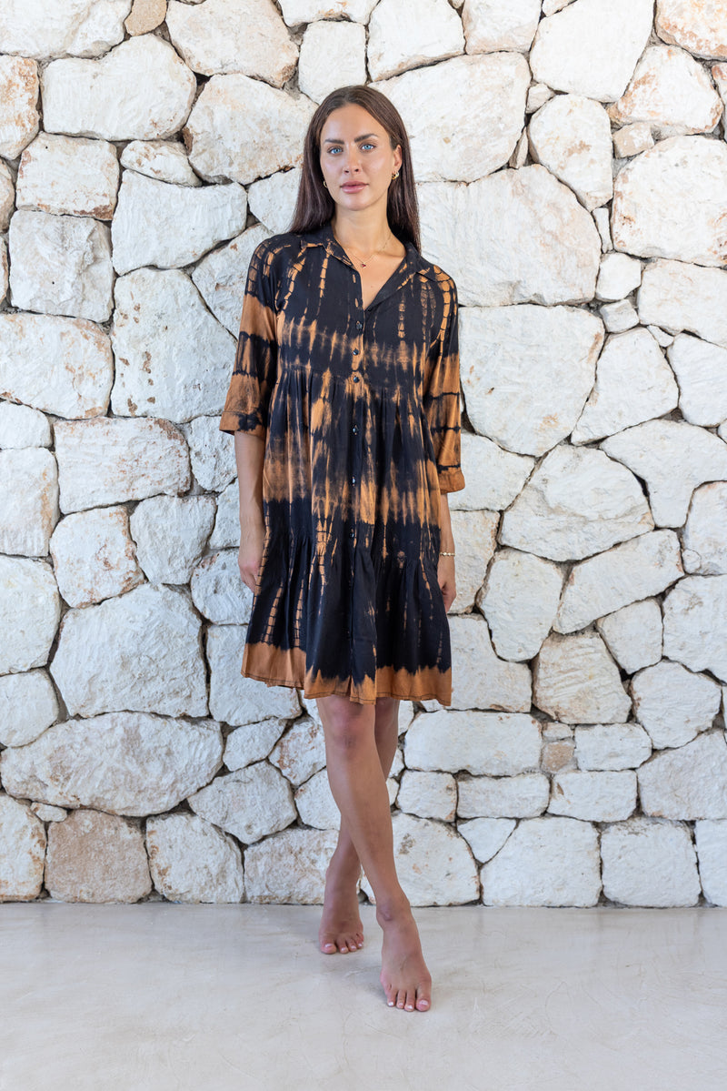 Womens button up short length tie dye dress in black and copper featuring a tiered silhouette, 3/4 length sleeves and pockets 