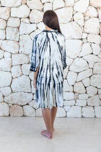 Womens button up short length tie dye dress in cream and black featuring a tiered silhouette, 3/4 length sleeves and pockets 