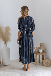 Womens mid length tie dye dress in black featuring a hand beaded neckline, kimono sleeves, elasticated waist and pockets