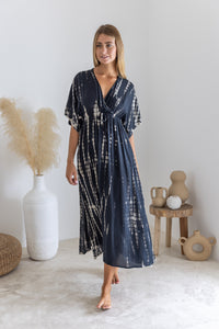 Womens mid length tie dye dress in black featuring a hand beaded neckline, kimono sleeves, elasticated waist and pockets