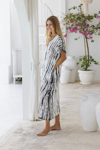 Womens mid length oversize tie dye kaftan in cream featuring a hand beaded neckline, short sleeves and pockets