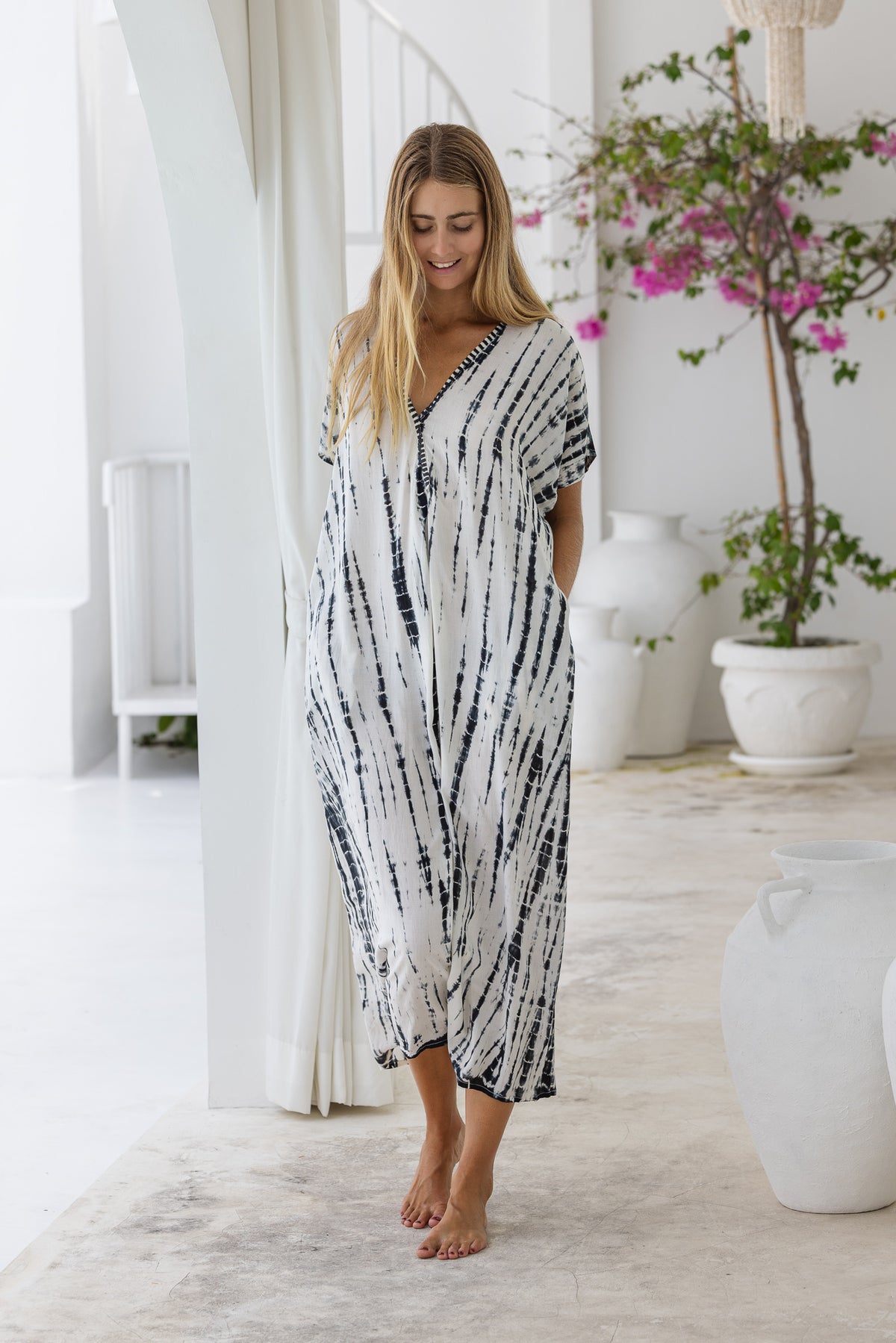 Womens mid length oversize tie dye kaftan in cream featuring a hand beaded neckline, short sleeves and pockets