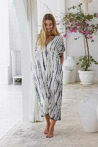 Womens mid length oversize tie dye kaftan in cream featuring a hand beaded neckline, short sleeves and pockets