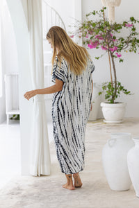 Womens mid length oversize tie dye kaftan in cream featuring a hand beaded neckline, short sleeves and pockets