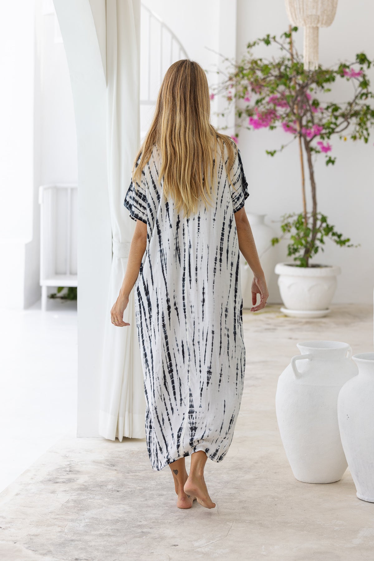 Womens mid length oversize tie dye kaftan in cream featuring a hand beaded neckline, short sleeves and pockets
