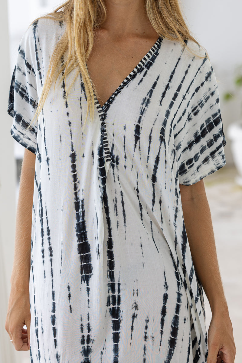 Womens mid length oversize tie dye kaftan in cream featuring a hand beaded neckline, short sleeves and pockets