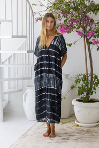 Womens mid length oversize tie dye kaftan in black featuring a hand beaded neckline, short sleeves and pockets