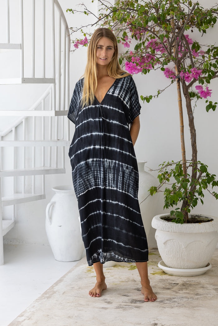 Womens mid length oversize tie dye kaftan in black featuring a hand beaded neckline, short sleeves and pockets