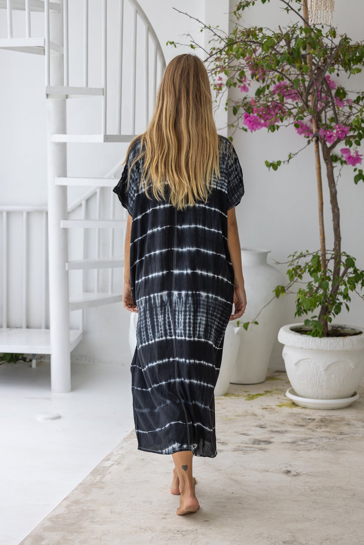 Womens mid length oversize tie dye kaftan in black featuring a hand beaded neckline, short sleeves and pockets