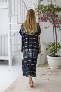 Womens mid length oversize tie dye kaftan in black featuring a hand beaded neckline, short sleeves and pockets