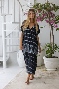 Womens mid length oversize tie dye kaftan in black featuring a hand beaded neckline, short sleeves and pockets