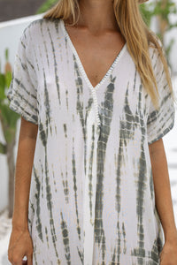 Womens mid length oversize tie dye kaftan in khaki and cream featuring a hand beaded neckline, short sleeves and pockets
