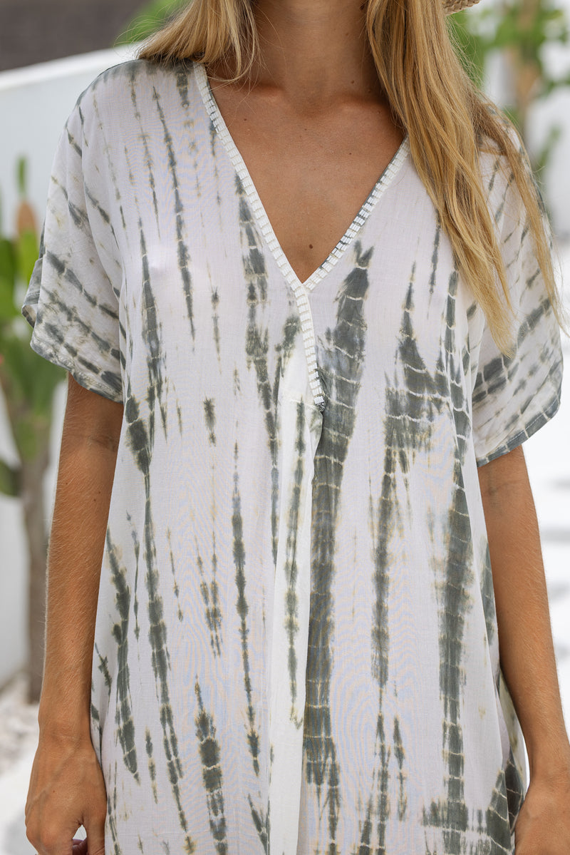 Womens mid length oversize tie dye kaftan in khaki and cream featuring a hand beaded neckline, short sleeves and pockets