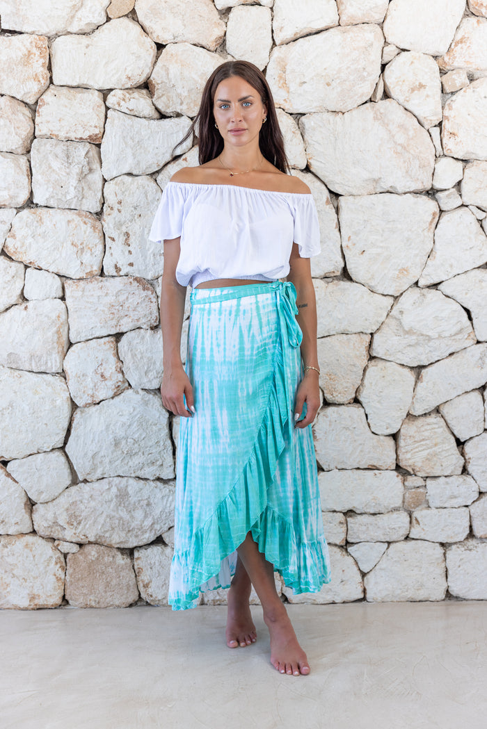 Womens long length tie dye wrap skirt in aqua blue featuring a self tie fastening and ruffle detail