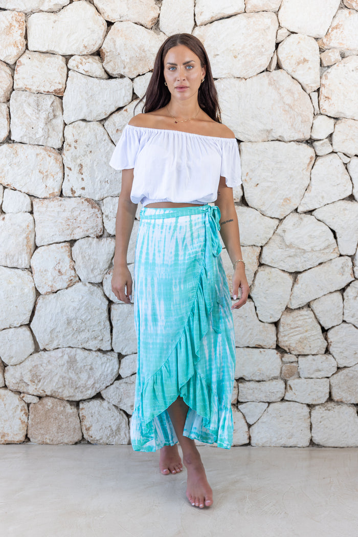 Womens long length tie dye wrap skirt in aqua blue featuring a self tie fastening and ruffle detail