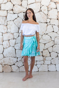 Womens short length tie dye wrap skirt in aqua blue featuring a self tie fastening and ruffle detail