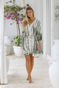 womens mid length tie dye tiered tunic dress in khaki and cream featuring a v neckline, long sleeves and side pockets