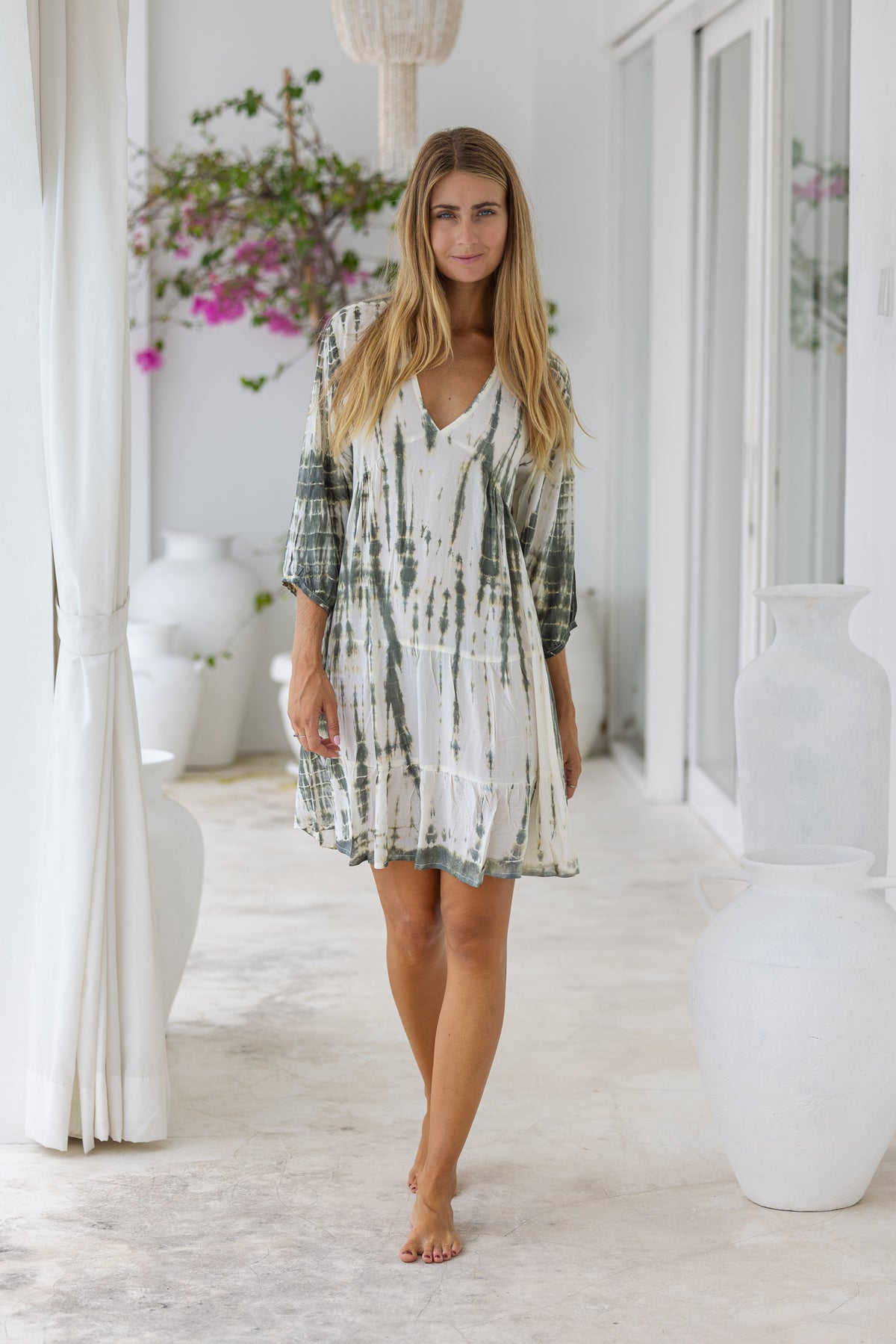 womens mid length tie dye tiered tunic dress in khaki and cream featuring a v neckline, long sleeves and side pockets