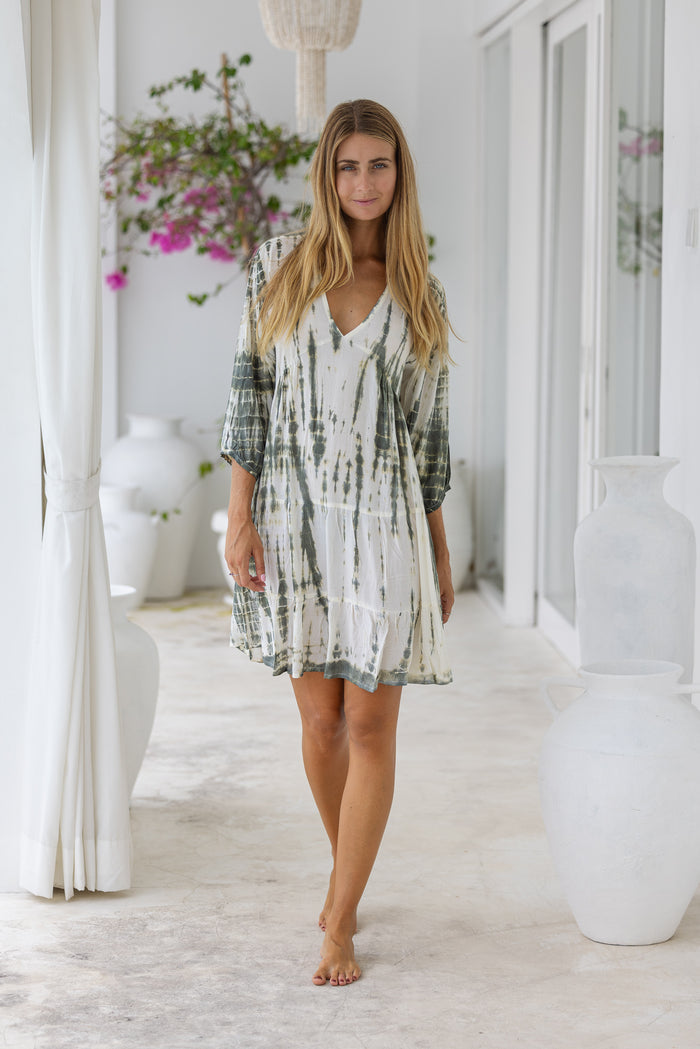 womens mid length tie dye tiered tunic dress in khaki and cream featuring a v neckline, long sleeves and side pockets