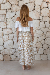 Womens stylish, lightweight and super soft long length skirt in brown and cream savannah ptint featuring an elasticated waist at the back and front/side split
