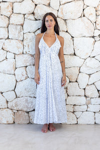 Womens stylish midi length halter neck dress in white polka dot featuring a deep V at the back with a pull tie detail under the bust