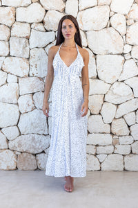 Womens stylish midi length halter neck dress in white polka dot featuring a deep V at the back with a pull tie detail under the bust