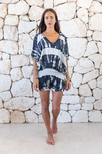 Womens stylish, super soft, lightweight, short length kaftan tie dye dress in black and cream featuring an elasticated waist and hand beaded v neckline