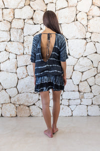 Womens stylish, super soft, lightweight, short length kaftan tie dye dress in black and cream featuring an elasticated waist and hand beaded v neckline