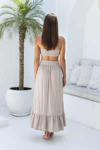 Womens super soft, comfortable and flattering Lorena Skirt in beige featuring a smocked waist and button down front closing