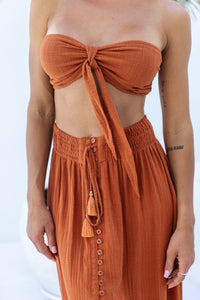 Womens super soft, comfortable and flattering Lorena Skirt in terracotta featuring a smocked waist and button down front closing