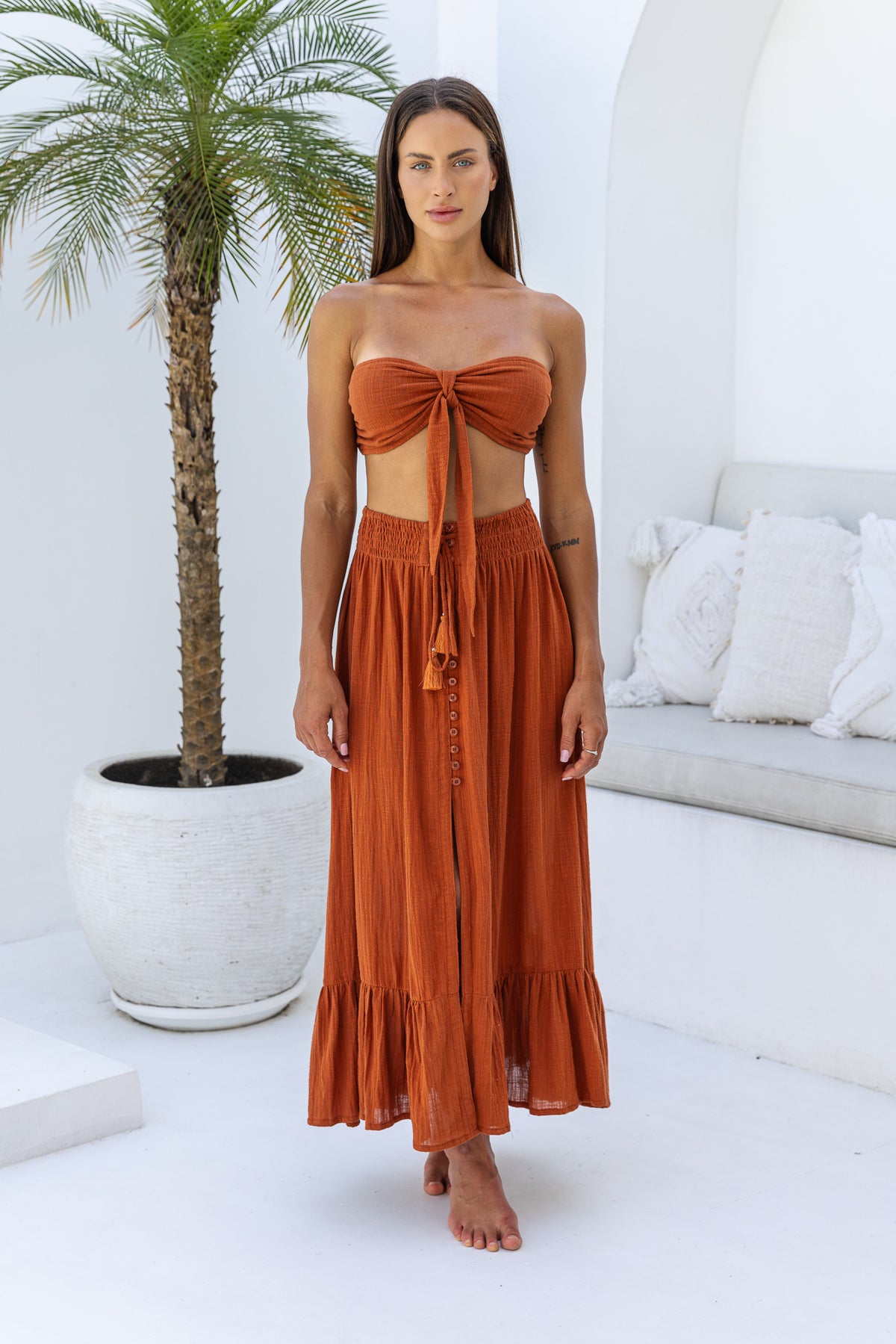 Womens super soft, comfortable and flattering Lorena Skirt in terracotta featuring a smocked waist and button down front closing