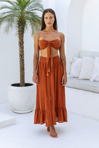 Womens super soft, comfortable and flattering Lorena Skirt in terracotta featuring a smocked waist and button down front closing