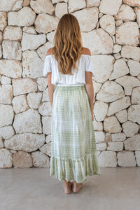 Womens tie dye skirt in green featuring a smocked waist and button down front closing